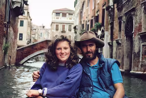 Bruce Josephs taking a gondola ride in Venice, Italy with a friend.